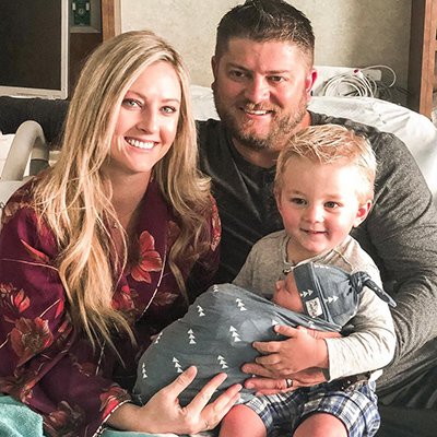 Canaan holds his new brother