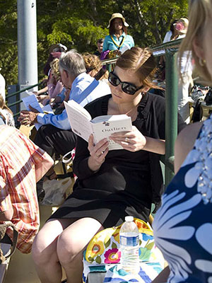 Heather reading Outlivers book